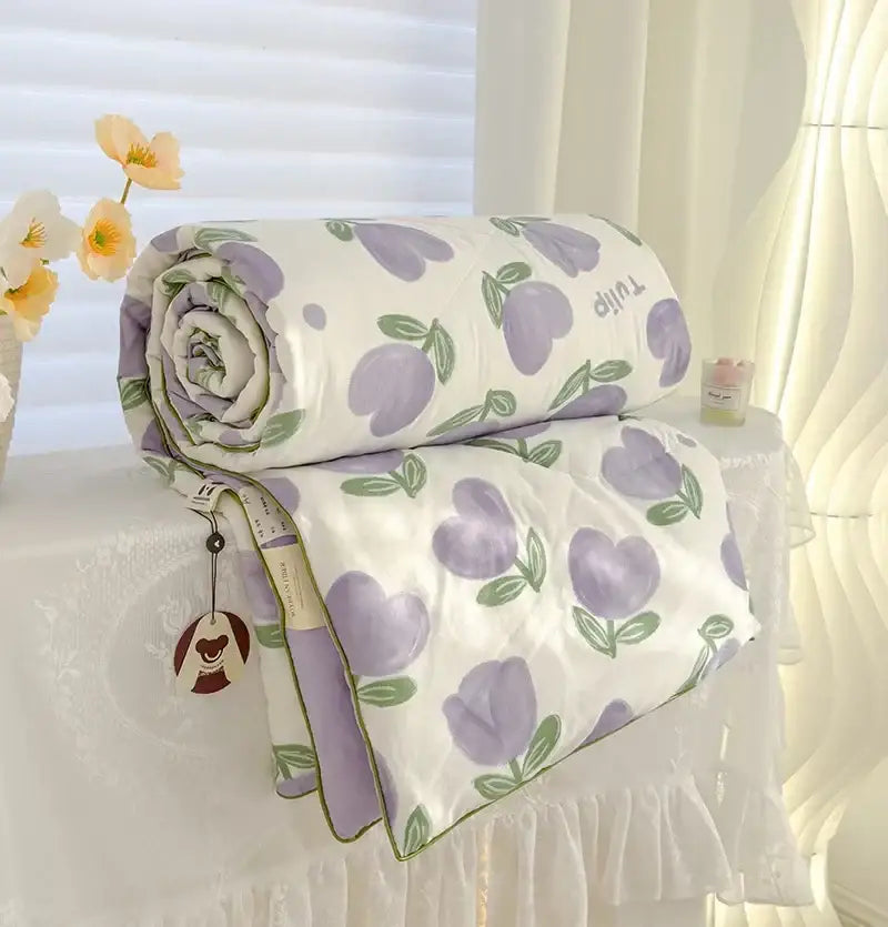 A soft cream teddy bear breathable double gauze quilt with lavender tulip pattern and ruffled edges for bedroom decor