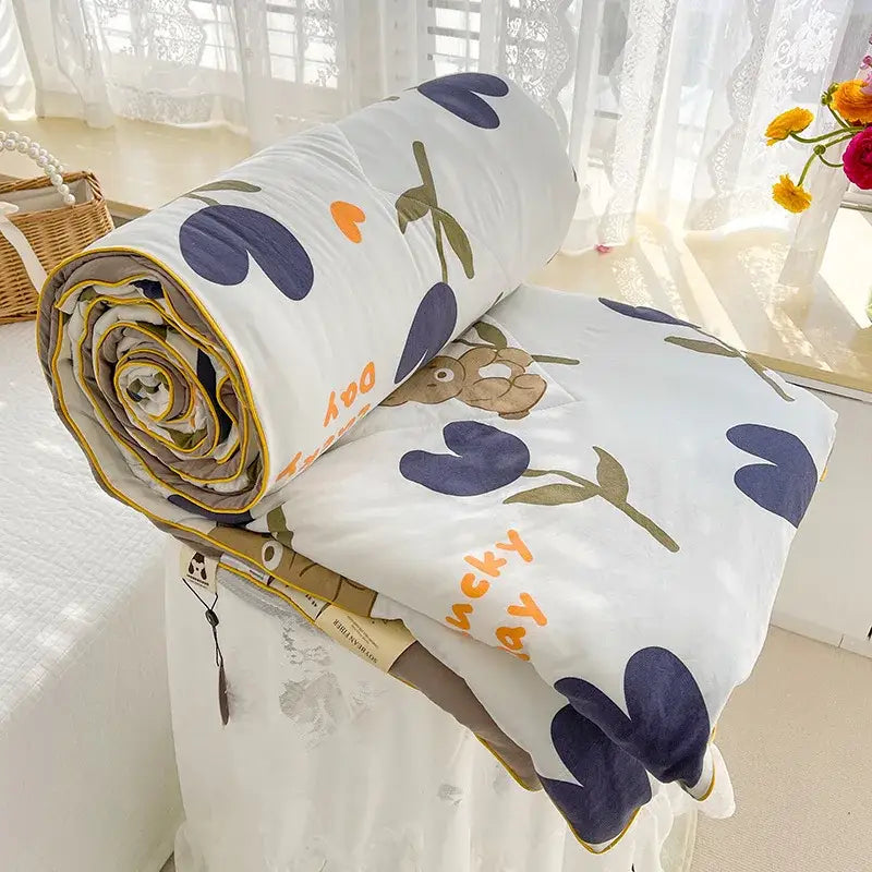 Cream teddy bear double layered soya fibre quilt with white cotton fabric navy heart flowers and yellow edge piping