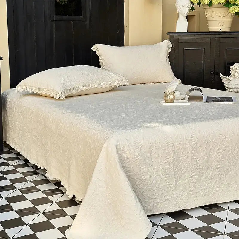 Cream textured cotton quilted bedspread set with delicate lace trim on pillows for elegant bedroom decorbites cotton quilted style