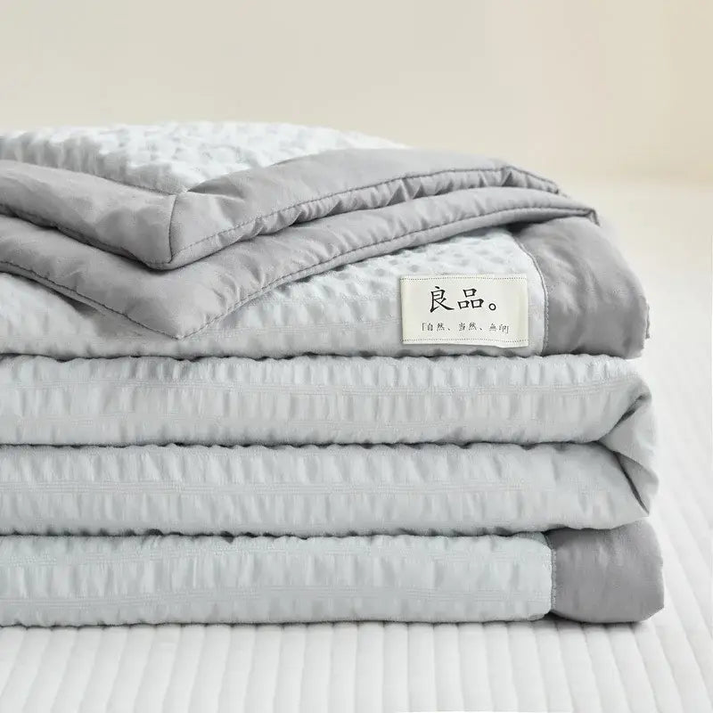 Stacked gray cream textured ice cream air summer quilt with subtle texture and decorbites ice cream branded label
