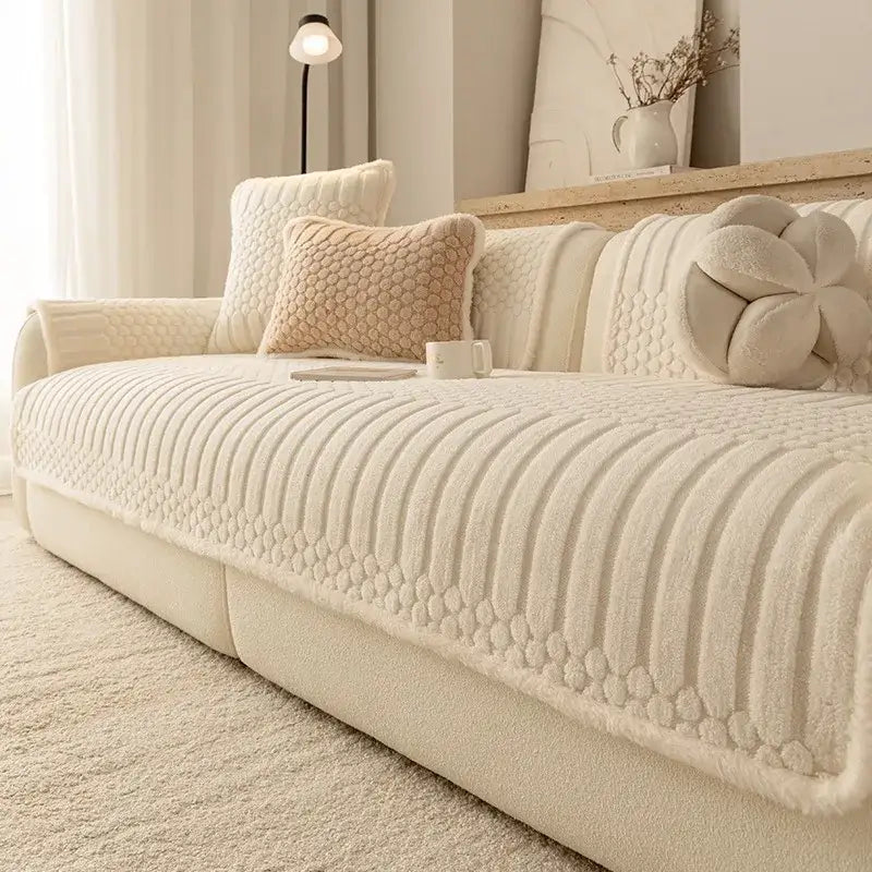 Cream textured jacquard knit sofa cover with plush towel material featuring ribbed and dotted patterns for living room use