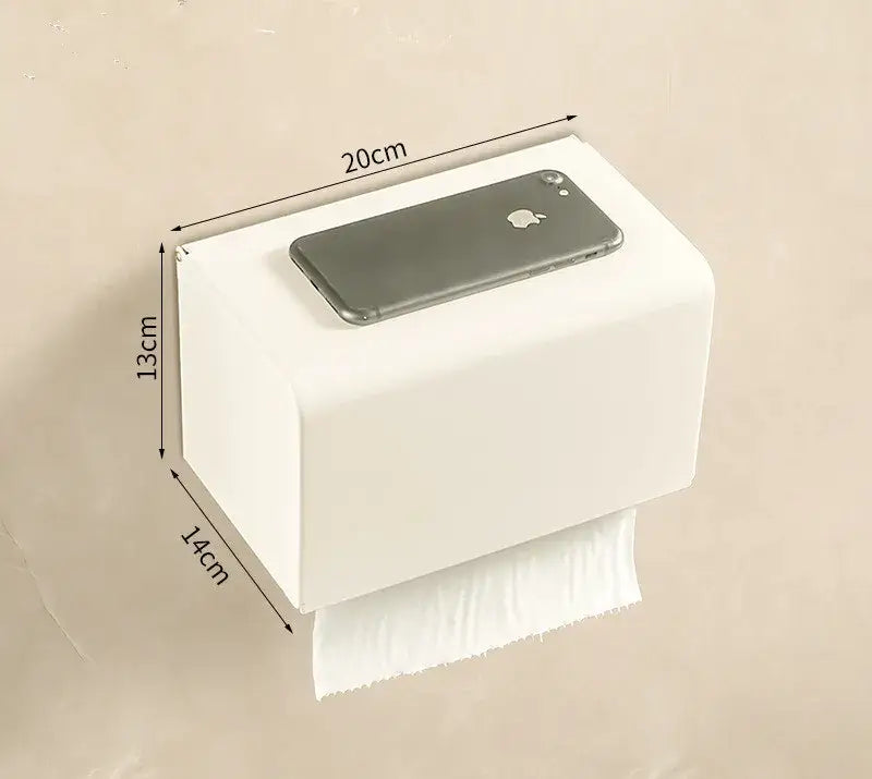 White rectangular wall-mounted toilet paper holder in cream white bathroom set with towel rack and storage shelf