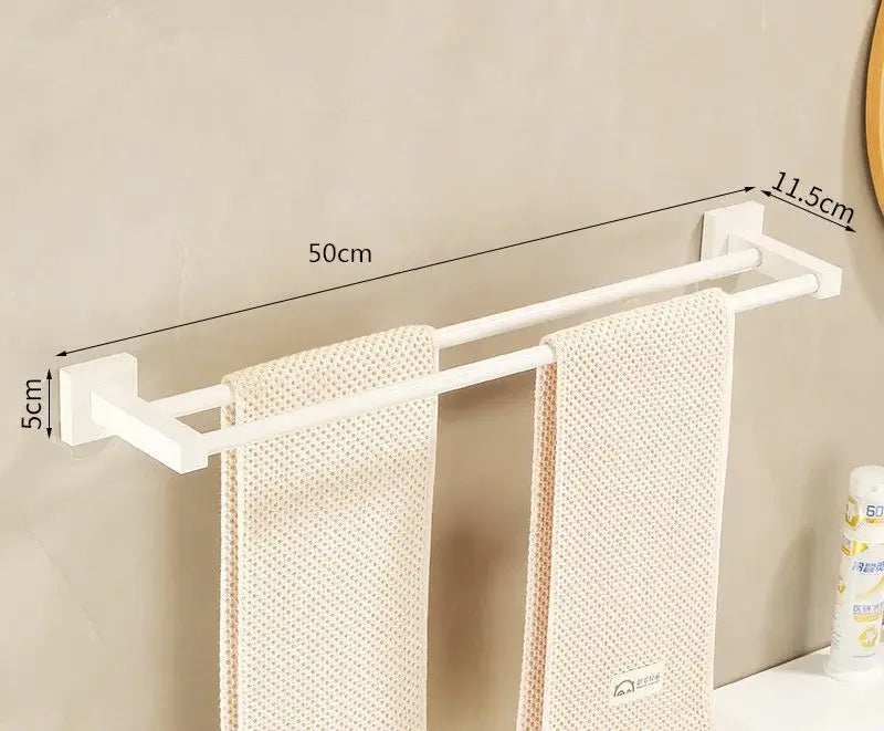 Cream white bathroom set featuring a wall-mounted white double-bar towel rack with sleek modern design brackets