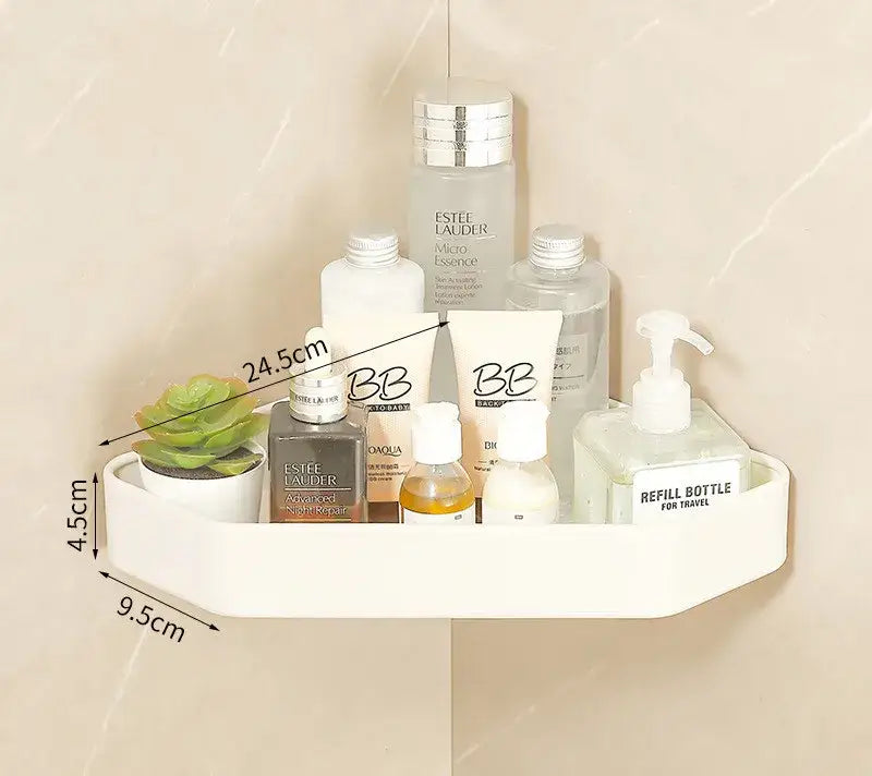 Cream white plastic corner shelf holding toiletries and a small potted succulent in bathroom set with towel rack