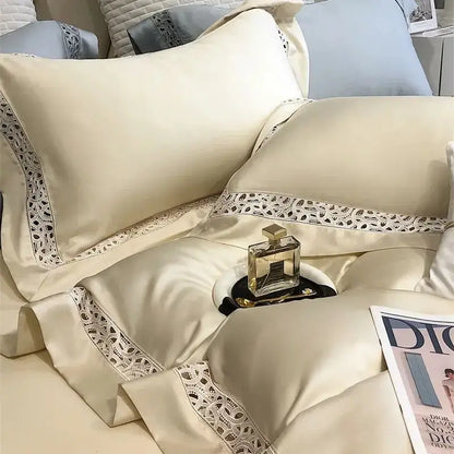 Cream-colored satin bedding set with delicate white lace trim made from decorbites eucalyptus fiber for luxury bedroom use