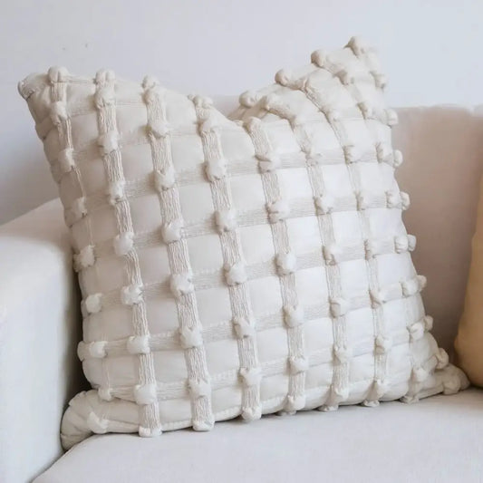Cream white plaid cushion cover with a textured grid pattern of raised pom-poms by decorbites for living room decor
