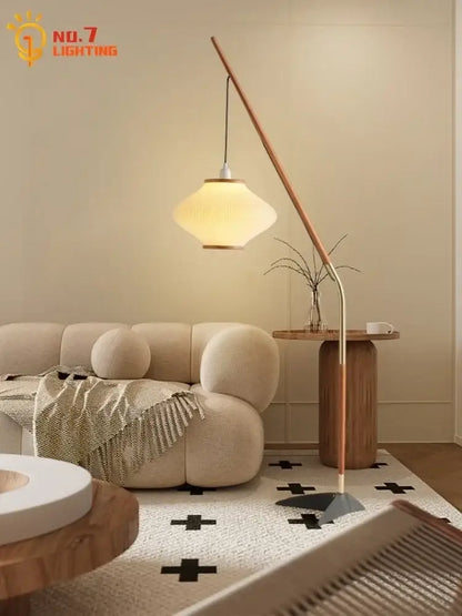 Modern floor lamp with cream wind acrylic amber glass shade and slender wooden arm for living room decorbites cream wind