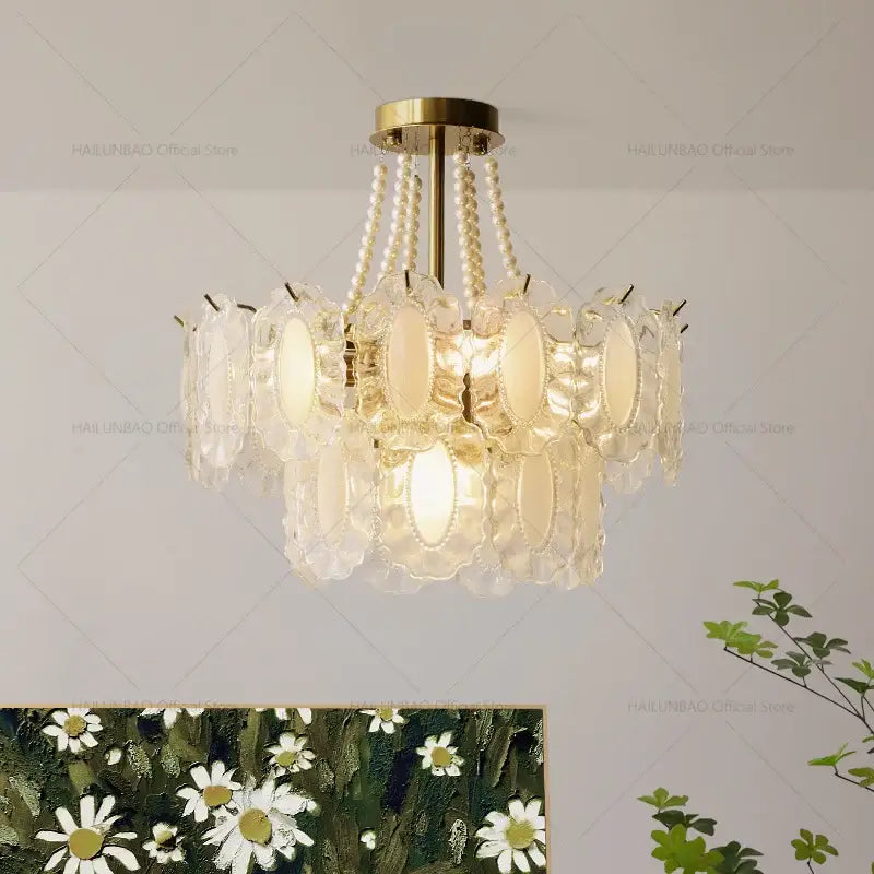Elegant cream wind crystal chandelier with gold ceiling mount, cascading pearl beads, and layered oval glass panels for living room decorbites cream wind