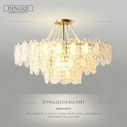Cream wind crystal chandelier gold living room pendant light with a modern gold-toned frame and cascading oval discs