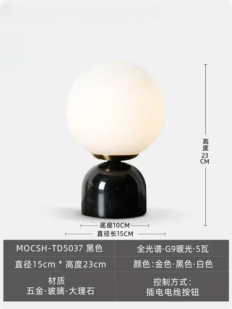 Cream wind marble table lamp with black marble base frosted white glass globe and gold-toned decorbites cream wind accents