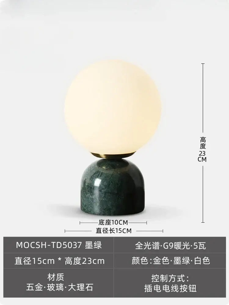 A sleek decorbites cream wind marble table lamp with a warm white glass globe and gold accents for modern decor