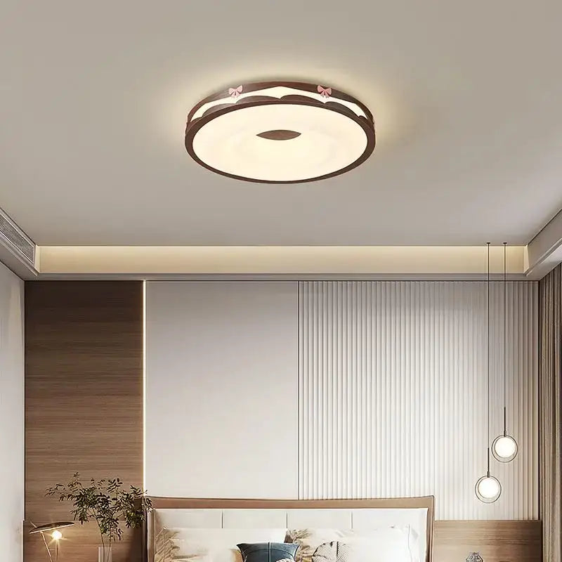 Circular cream wind walnut round bedroom light with dark wood frame soft white center and pink bow decorbites cream wind