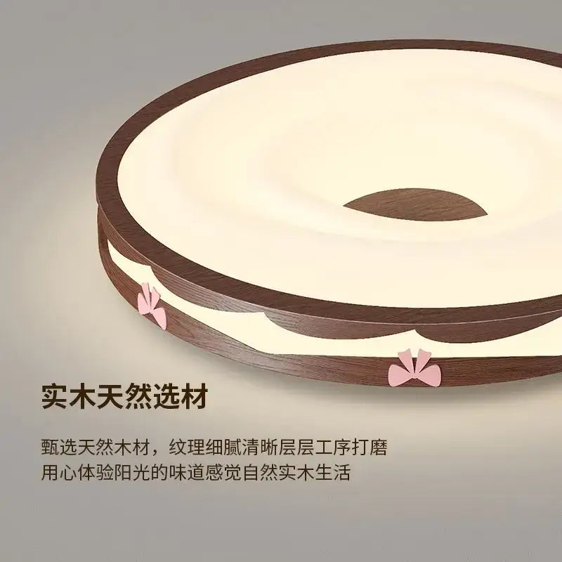 Circular bedroom light with cream wind walnut frame, cream center, and pink bow accents by decorbites cream wind