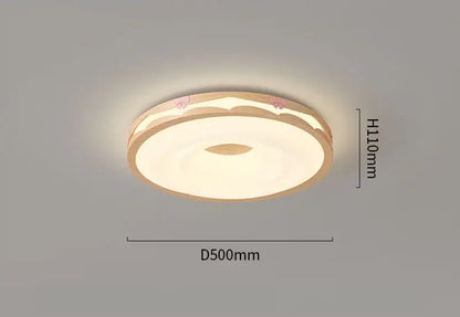 Cream wind walnut round bedroom light with warm beige frame soft white diffuser and pink floral accents by decorbites cream wind
