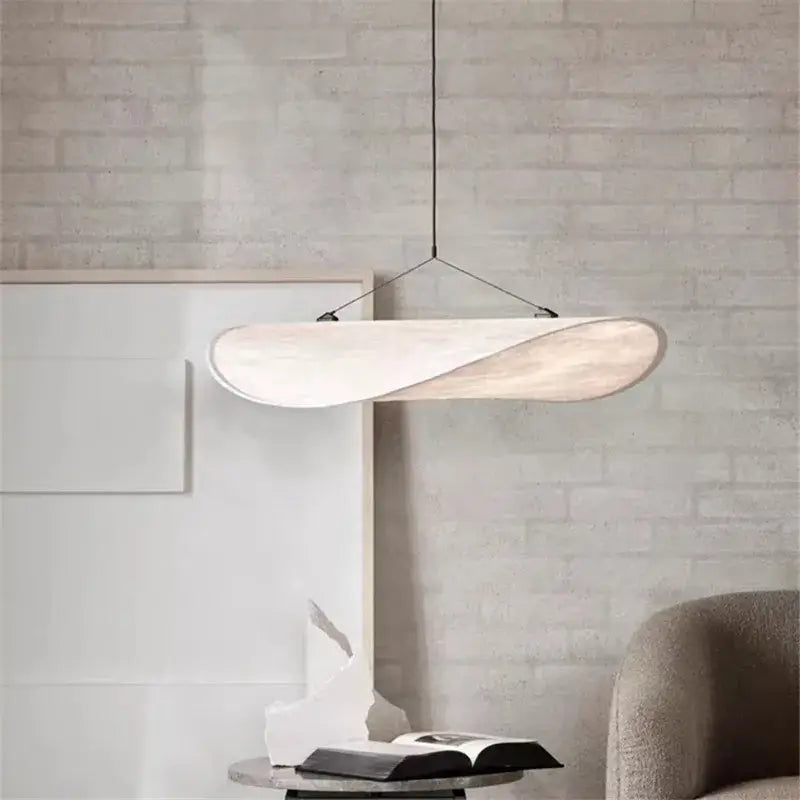 Modern white pendant light with a sleek twisted wooden design suspended by black cord for decorbites tense lamp decor