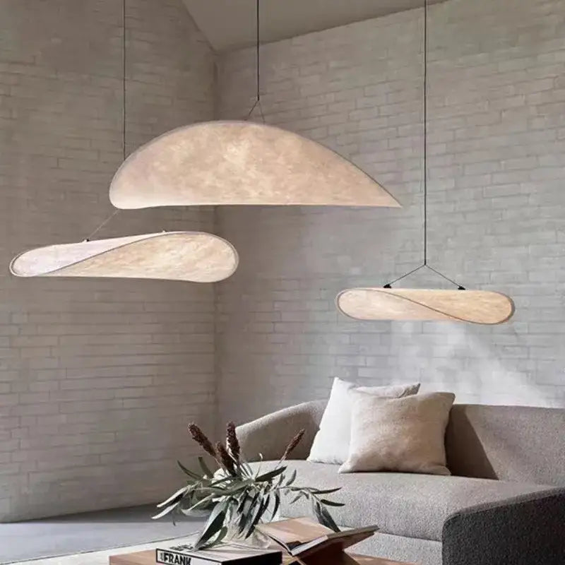 Three cream woven pendant lights with organic shapes and warm fabric finish for living room decorbites tense lamp