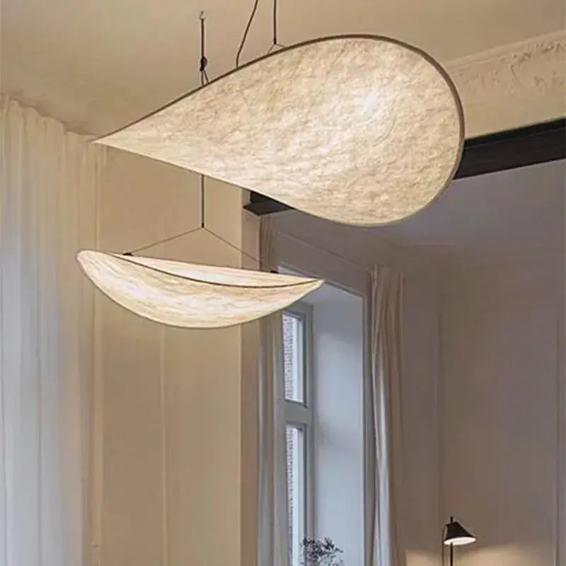 Cream woven teardrop pendant light with textured fabric shade suspended by black cords for decorbites tense lamp decor