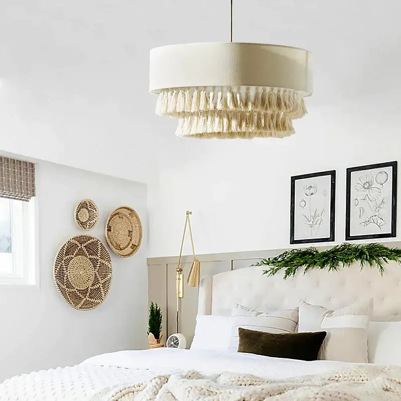 Cream-colored cylindrical pendant light with layered tassels for bedroom decorbites creamy bohemian wabi style