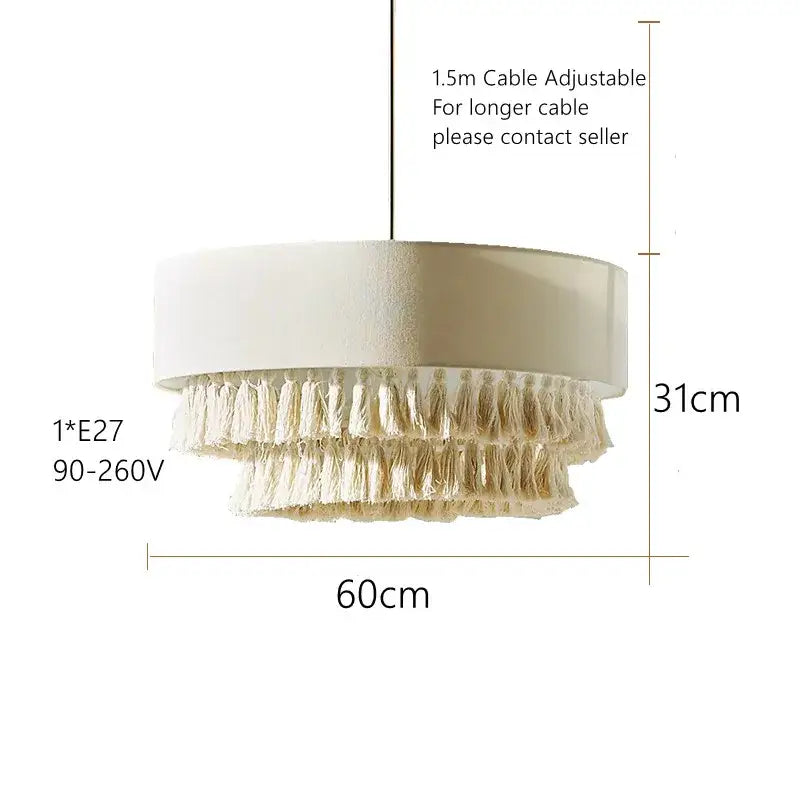 Cream-colored tiered pendant light with textured cylindrical top and natural fiber tassels for decorbites creamy bohemian decor