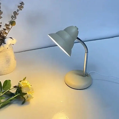 A sleek matte cream decorbites creamy style desk lamp with flexible gooseneck and soft white light for reading