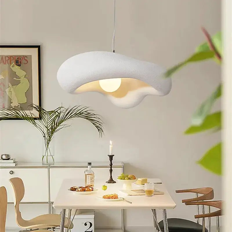 A modern off white creamy style pendant light with a cloud-like textured surface for dining room decorbites creamy style