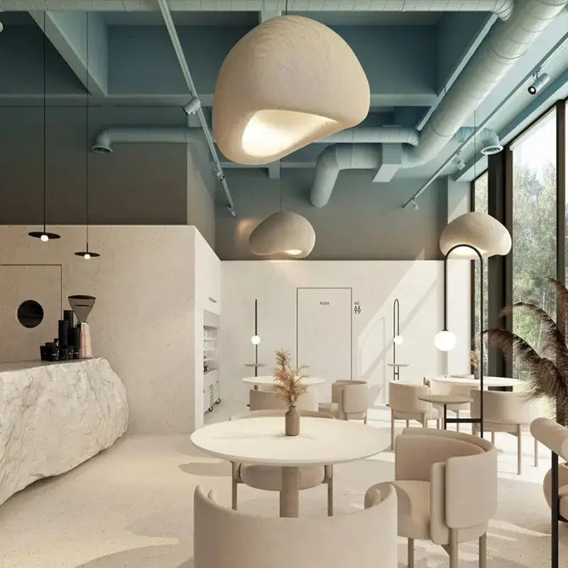 Cream-colored organic-shaped pendant light with soft matte finish for stairs and living room decorbites creamy style wabi