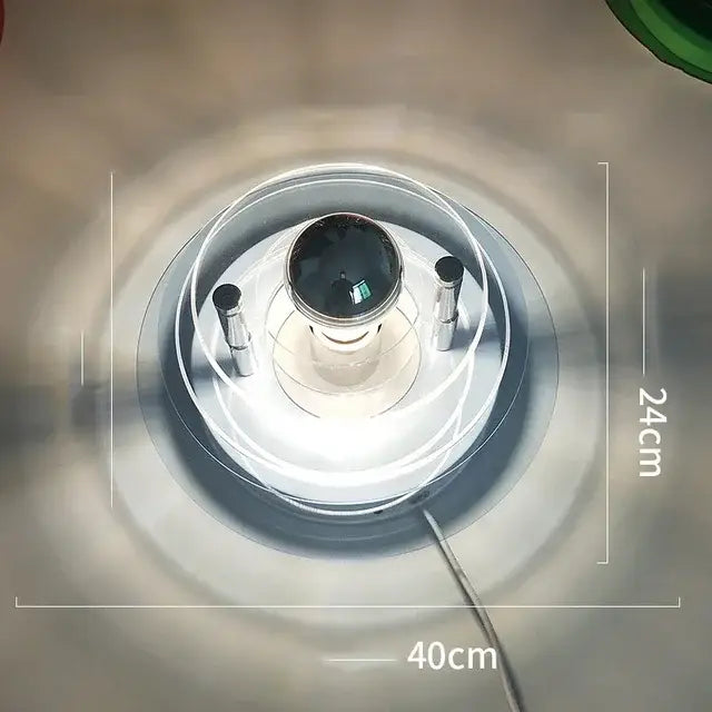 A modern creative acrylic wall lamp with a circular clear glass base and metallic accents for colorful decorbites decor