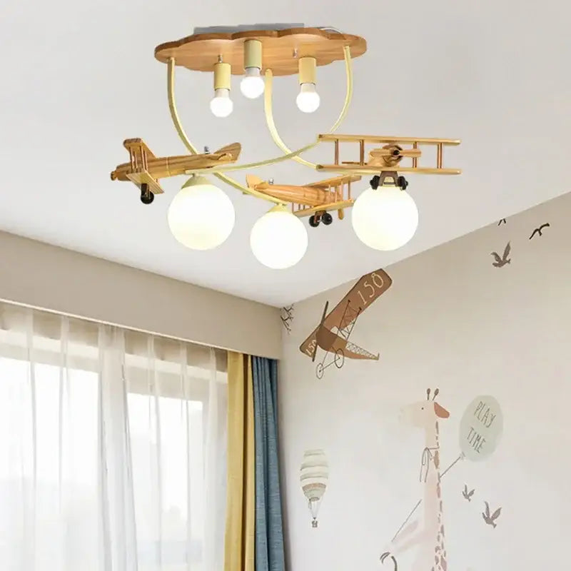 Creative airplane led wooden chandelier with three spherical bulbs on cloud-shaped wooden base for boys bedroom