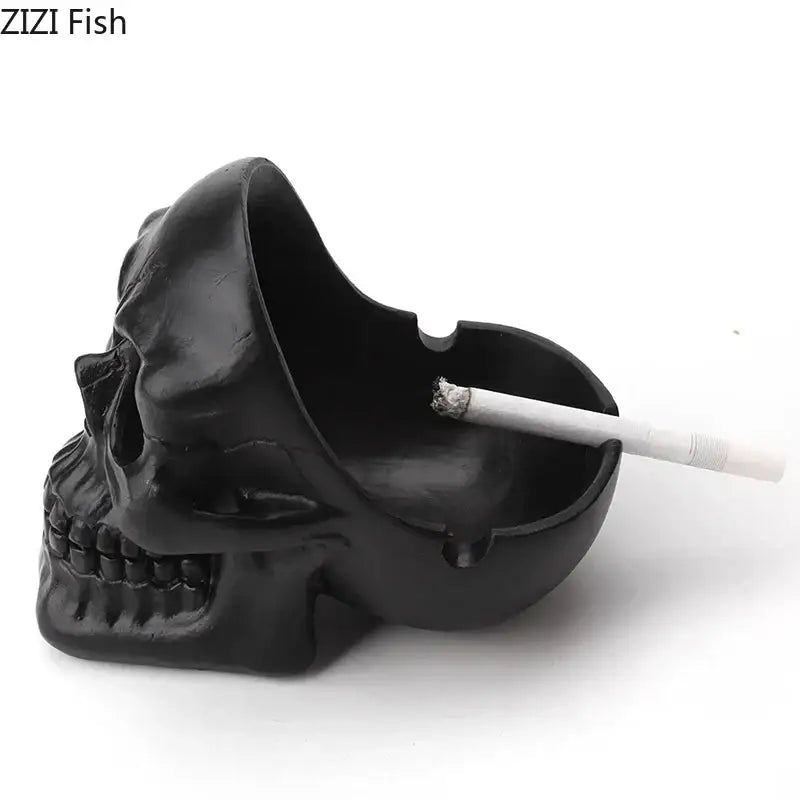 Creative black skull ashtray with matte finish and detailed facial features holding a cigarette for living room use