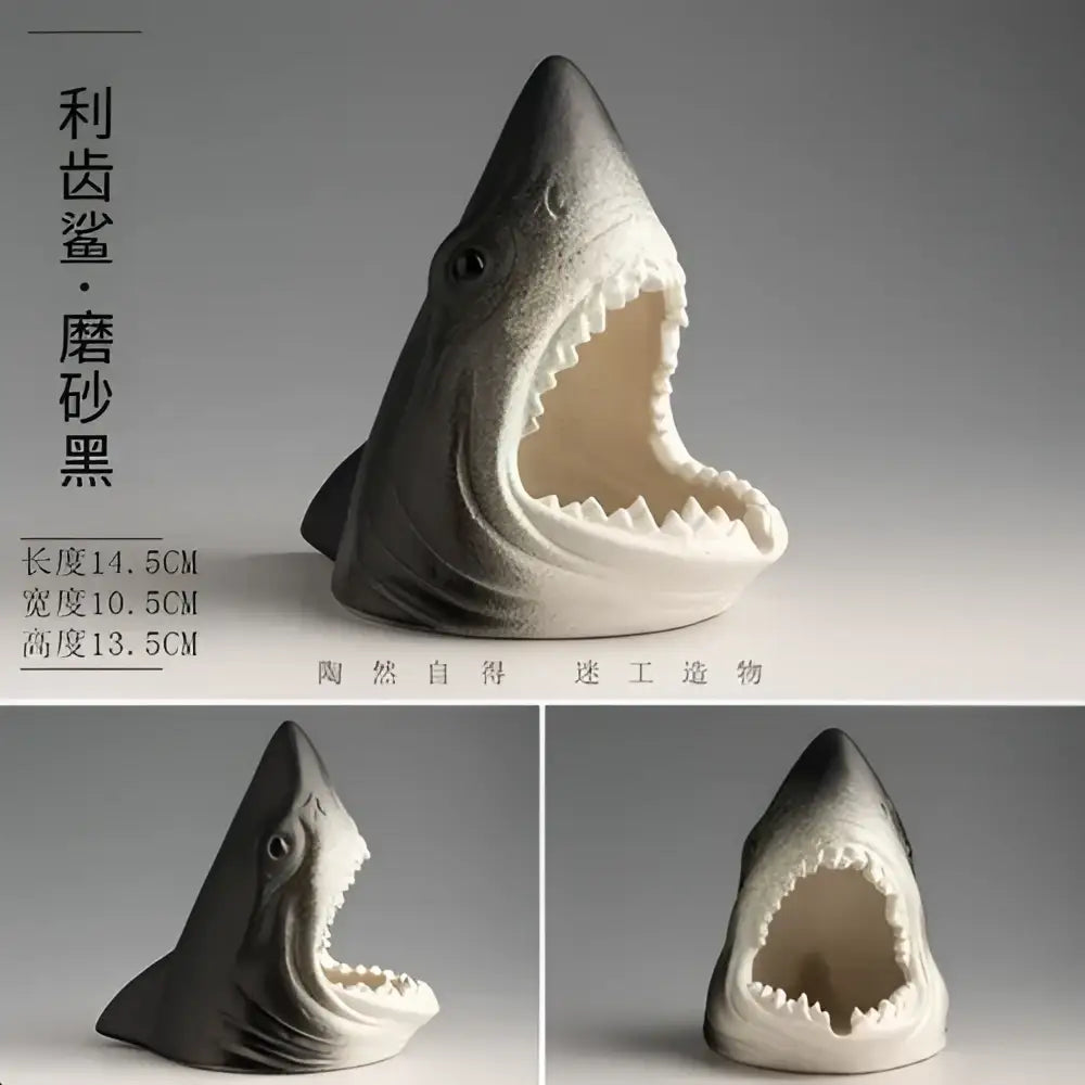 A sleek matte black and white shark storage ashtray with sharp teeth for creative shark decorbites living room use