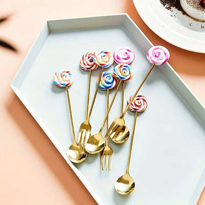 Set of gold-toned spoon and donut dessert fork with creative candy donut colorful swirled lollipop handles for dining