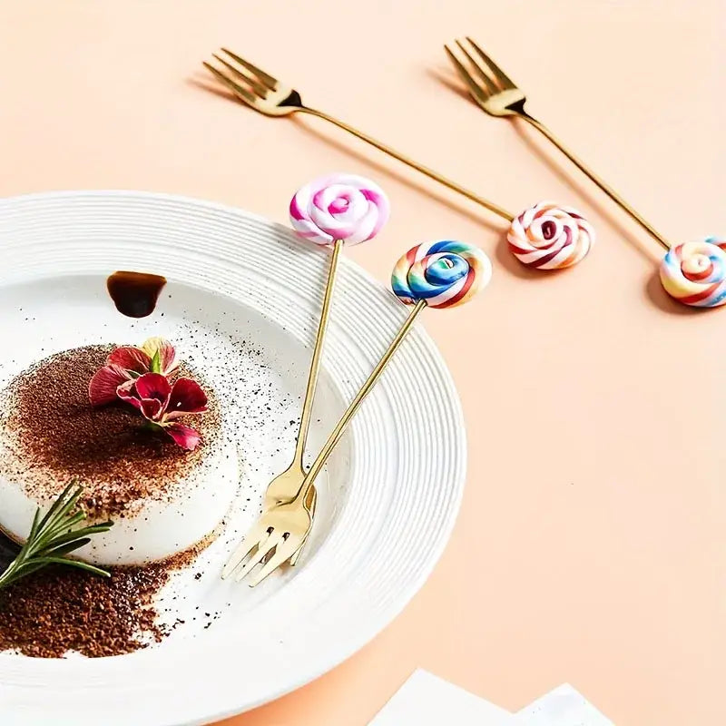 Gold-colored dessert forks with creative candy donut swirled candy rose handles for dining room use