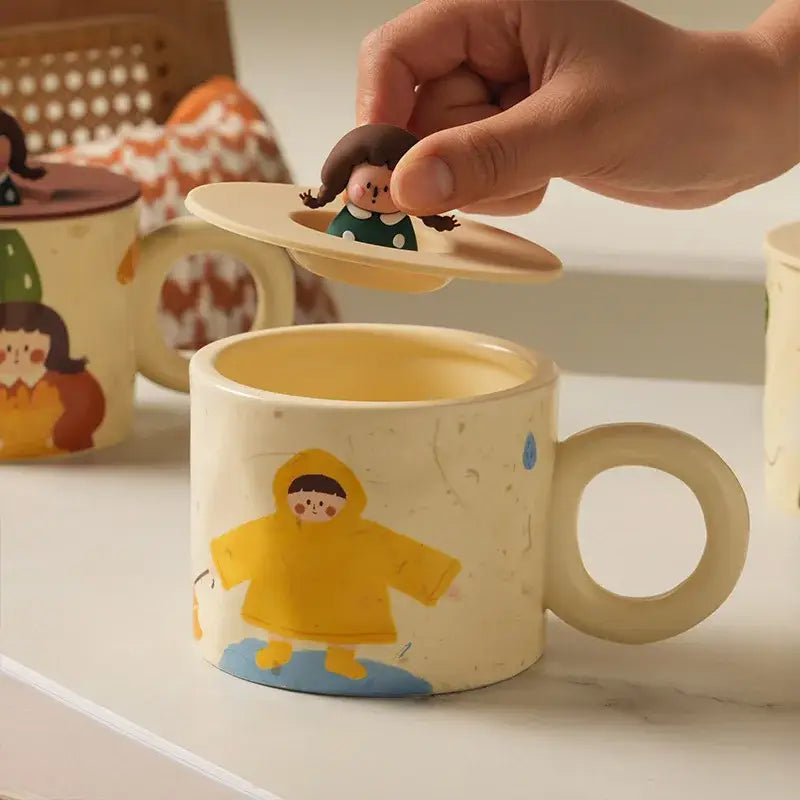 Cream-colored decorbites creative ceramic coffee mug with cartoon child, matching flying saucer lid, and miniature figurine