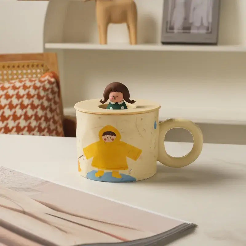 Cream-colored decorbites creative ceramic coffee mug with yellow raincoat child illustration and matching figurine lid