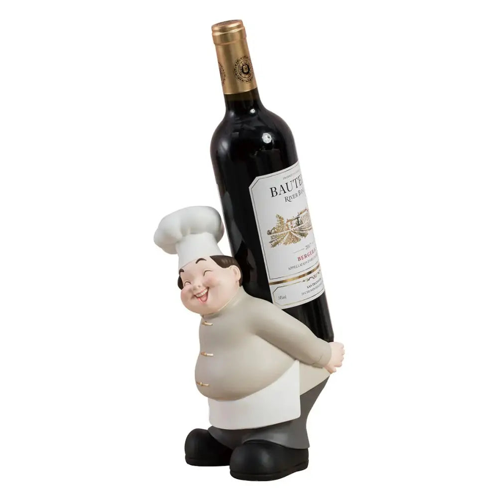 A creative chef wine rack sculpture featuring a cheerful chubby chef figurine holding a dark wine bottle with gold foil