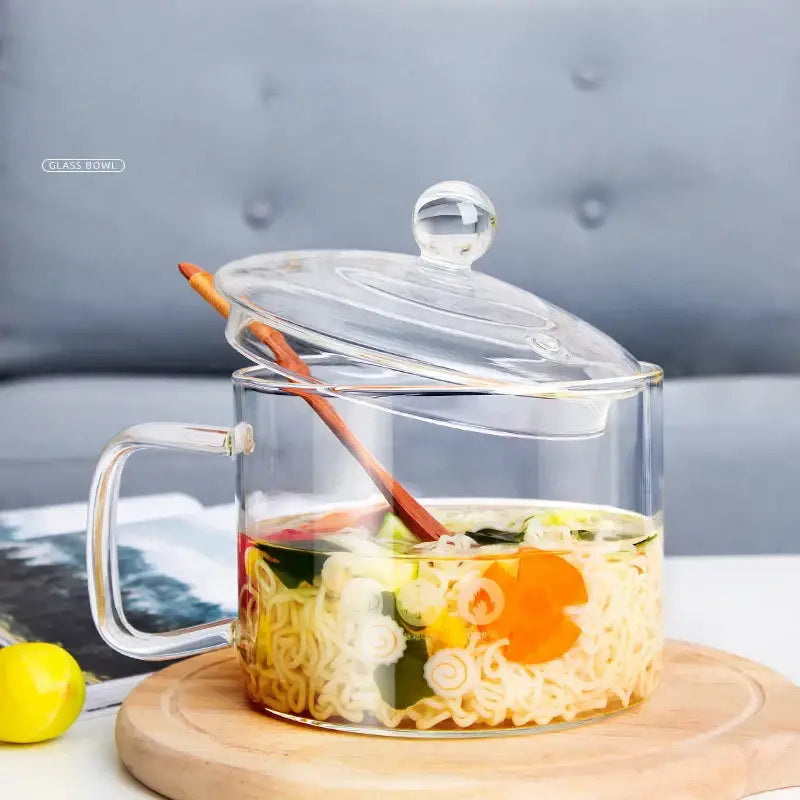 Creative clear glass salad bowl with handle and lid containing instant noodles in broth for kitchen and dining room use