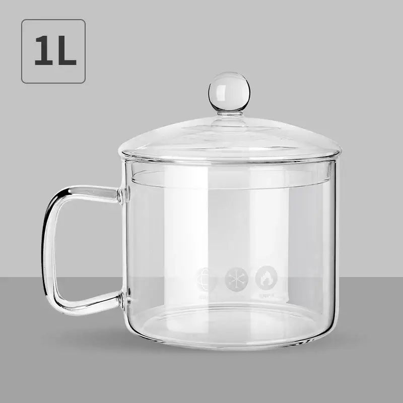 Clear glass salad bowl with handle and matching lid featuring three etched icons for kitchen and dining room use