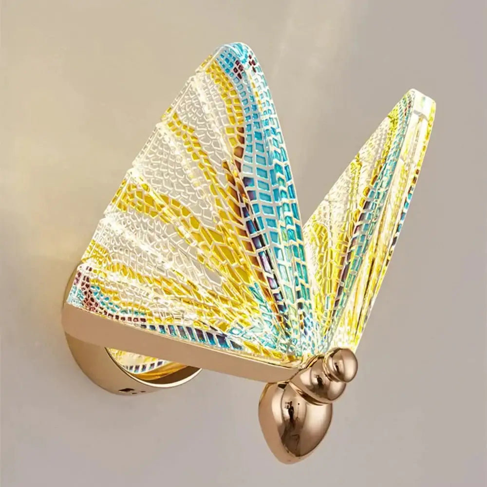 A creative colorful butterfly led wall lamp with yellow and turquoise mosaic glass wings and gold metal frame for bedroom