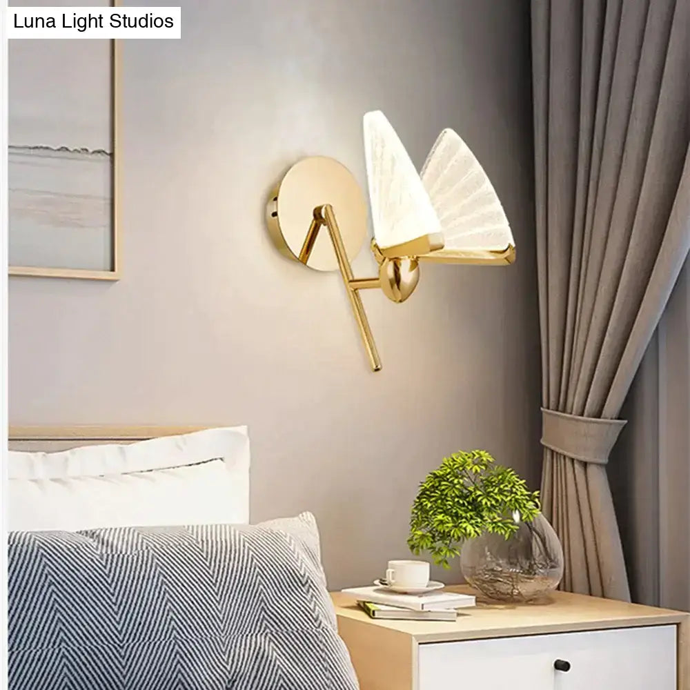 Gold-toned nordic creative colorful wall sconce with two frosted fan-shaped glass shades for bedroom lighting