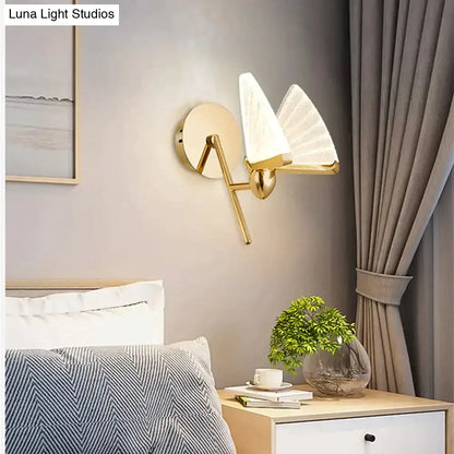 Gold-toned nordic creative colorful wall sconce with two frosted fan-shaped glass shades for bedroom lighting
