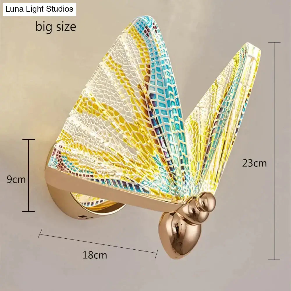 Creative colorful butterfly led wall lamp with intricate yellow blue and white mosaic wings on gold metallic body