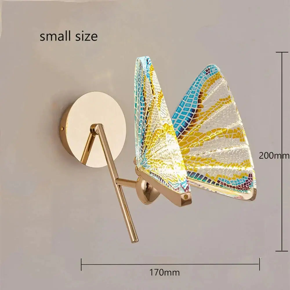 Creative colorful butterfly led wall lamp with yellow blue white mosaic glass wings on a gold-toned metal frame
