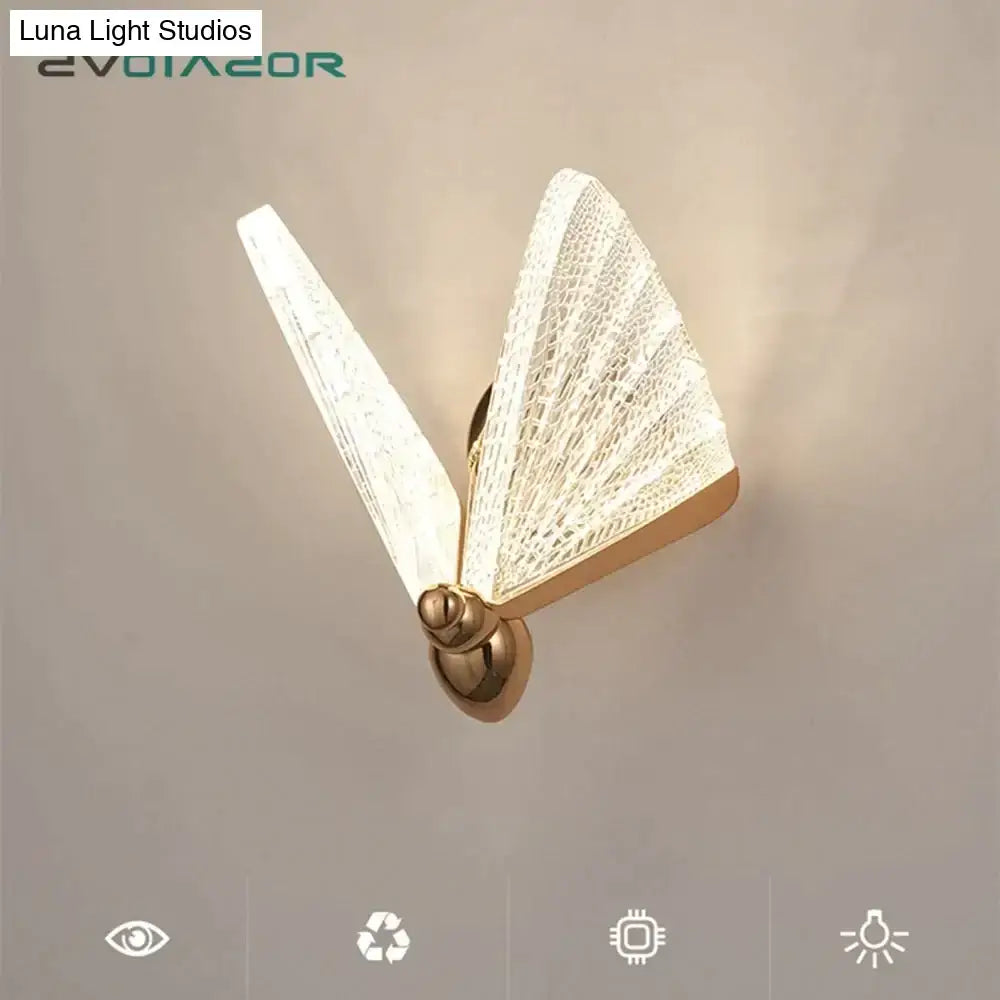 Gold-toned creative colorful butterfly led wall lamp with translucent textured wings and sleek metallic base for bedroom use