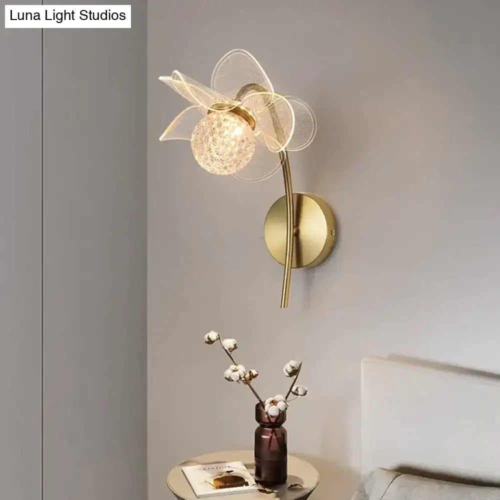 Creative floral decorative gold led wall lamp with mesh flower design and faceted crystal center for bedroom use