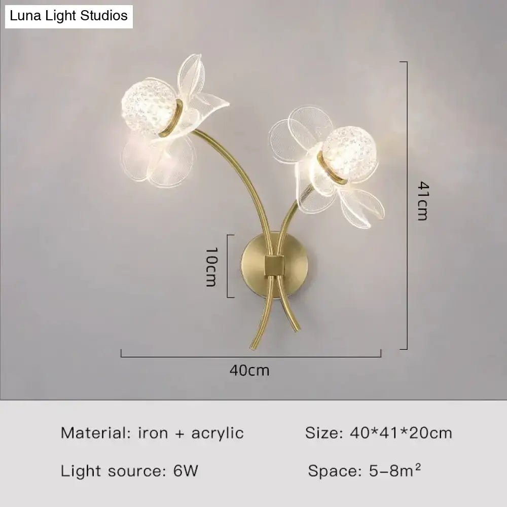 Creative floral decorative gold led wall sconce with translucent acrylic flower heads and iron textured glass spheres
