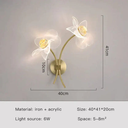 Creative floral decorative gold led wall lamp with two white acrylic flower fixtures and amber crystal accents for bedroom