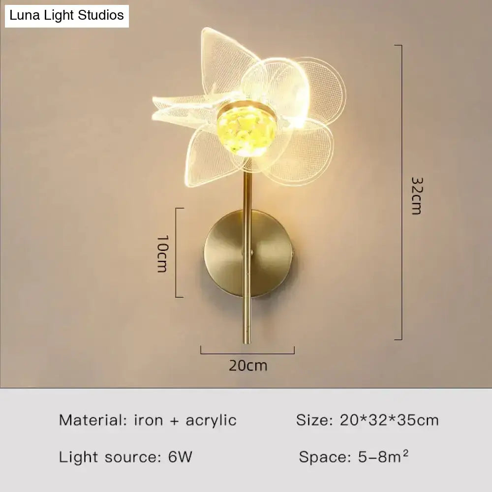 Creative floral decorative gold led wall lamp featuring a delicate translucent white flower with a brass iron base