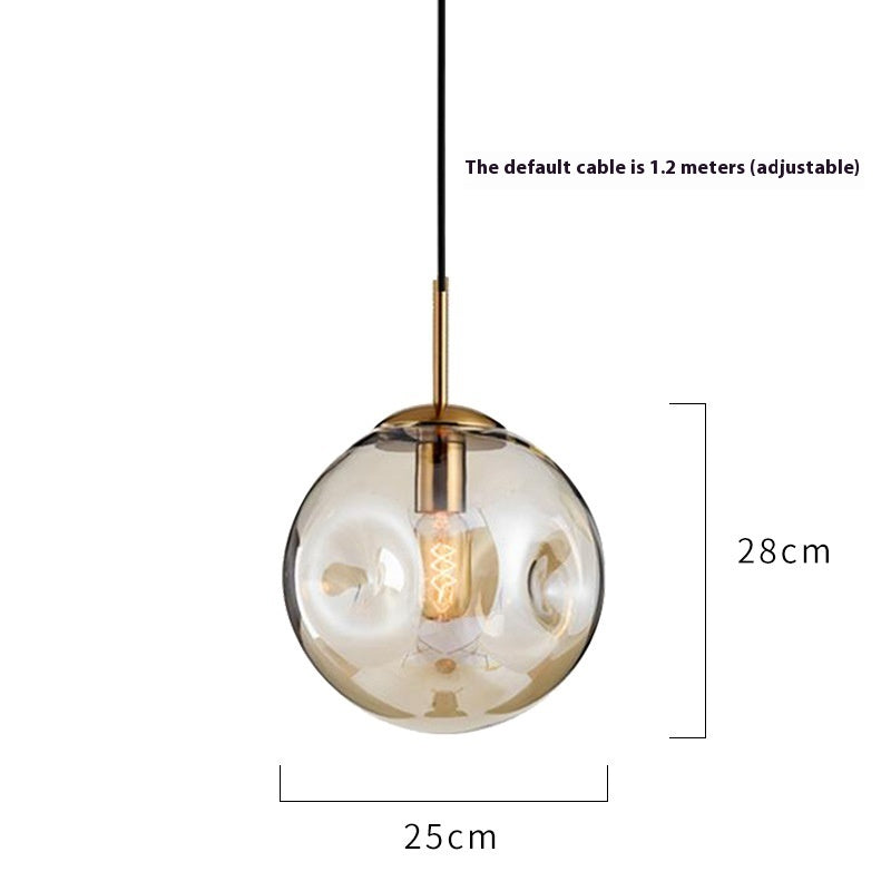 Gold and glass globe pendant light with black cord
