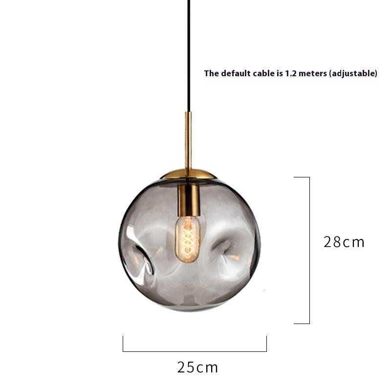 25cm diameter smoked glass globe pendant light with brass accents.