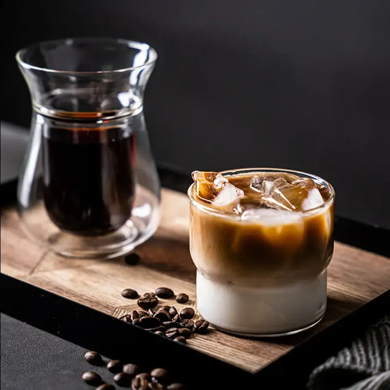 A clear glass coffee smoothie cup with layered iced espresso and milk heat resistant decorbites creative drinkware